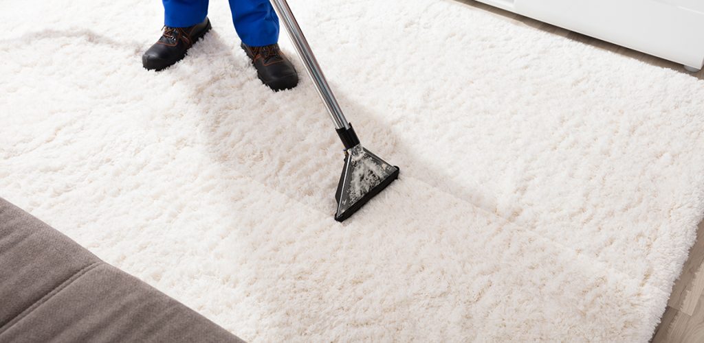Close-up,Of,A,Janitor,Cleaning,Carpet,With,Vacuum,Cleaner,At Close-up Of A Janitor Cleaning Carpet With Vacuum Cleaner At Home
